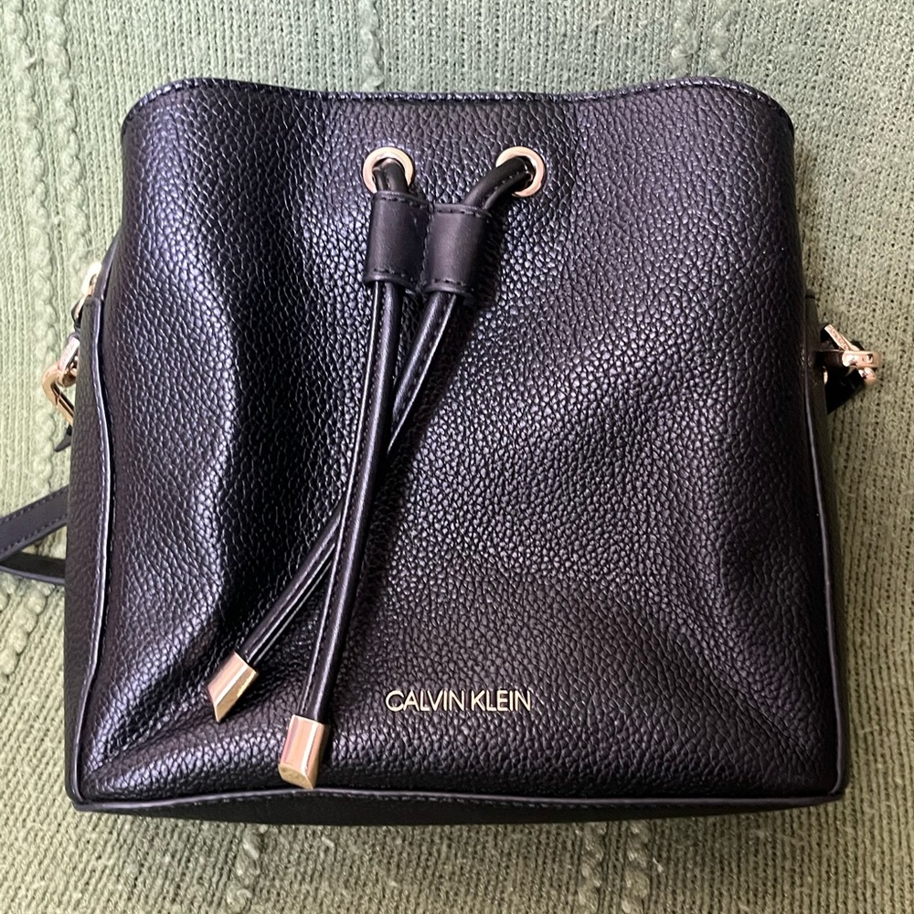 CALVIN KLEIN
Fay Drawstring Hobo with Adjustable Web Strap leather purse